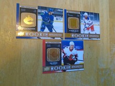 2021-22 UD Series 1 Hockey Gold SP Rookie Retrospective Hoglander--Stuzle-Miller