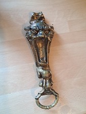 Rare old golden haunted bottle opener