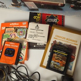 Atari CX-2600 Console Bundle Complete in box w 10 CIB games working 1980
