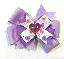 Beautiful Valentine's Day Hugs inspired hair bow for girls.
