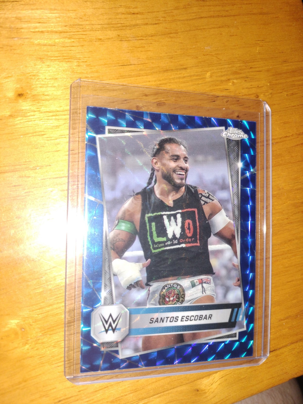 2025 Topps Chrome WWE Santos Escobar #60 Blue Geometric Refractor 81/99
