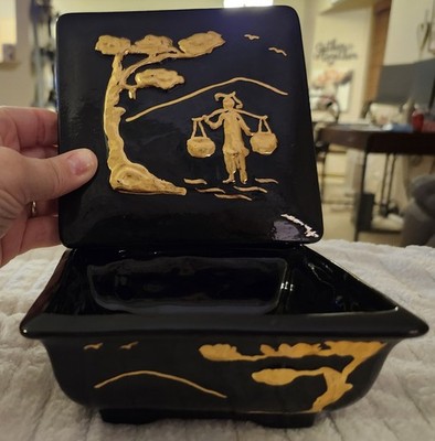 A Vintage black decorative box with gold relief by Kleine Co.