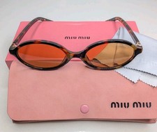 Miu Miu Women  s Tortoise Shell Oval Sunglasses Brown Tinted Lenses Logo
