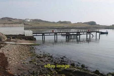 Photo 6x4 Lagavulin Pier On the loch side of the distillery c2019