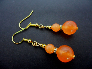 Authentic A PAIR OF ORANGE JADE GOLD PLATED EARRINGS. .