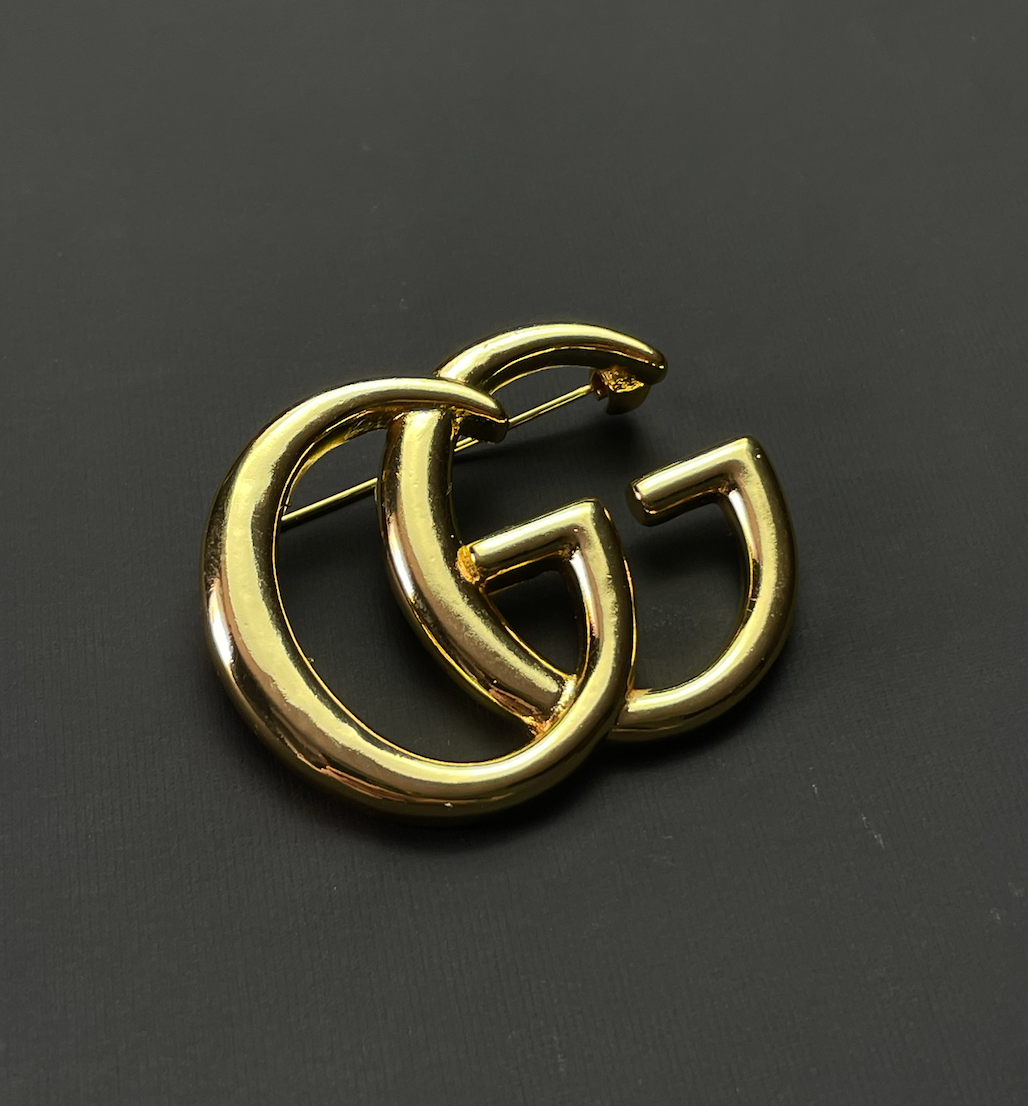 GUCCI GGロゴ ブローチ Metal Double G brooch with crystals in crystals | GUCCI® US