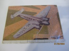 VINTAGE LOCKHEED ELECTRA PROP PLANE ART BY IRWIN HOLCOMBE JIGSAW PUZZLE
