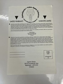 Nintendo Game Genie Video Game Enhancer NES With Manuals & Inserts