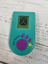 NICK PUZZLER ELECTRONIC HANDHELD TRAVEL GAME TRAVEL MEMORY PUZZLE TOY 1995 A