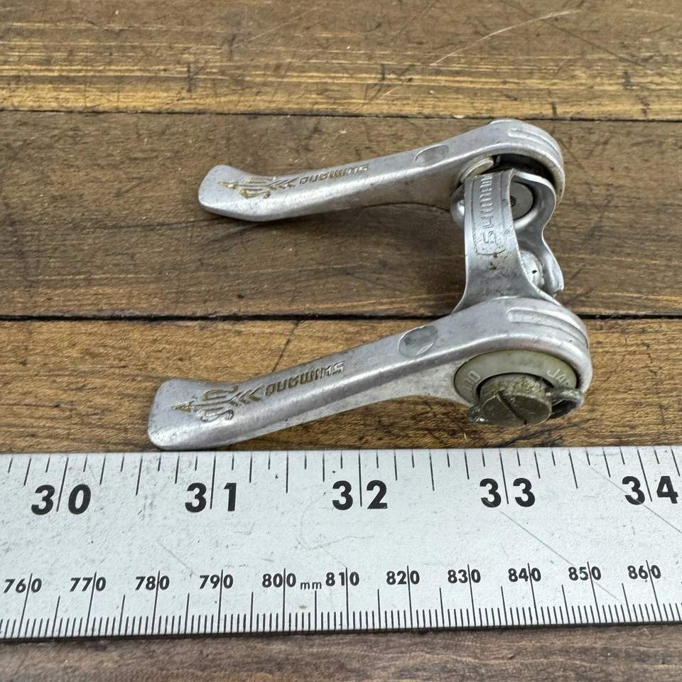 Palancas de cambio de tubo Shimano flecha dorada vintage plateadas hechas en Japón abrazadera de carretera Foto 3 de 4