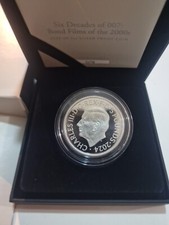 Royal Mint 2024 SIX DECADES OF 007 BOND FILMS 2OZ SILVER PROOF COIN