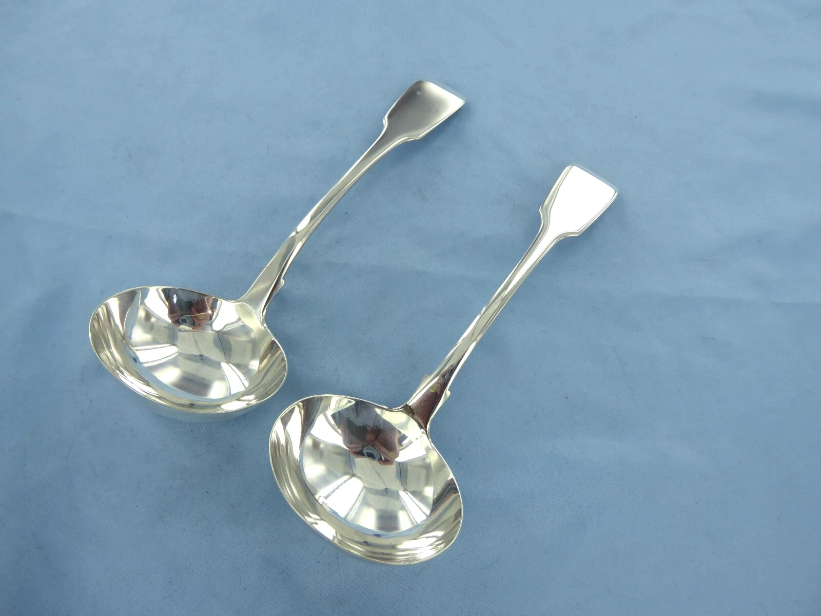 AN ANTIQUE PAIR OF STERLING SILVER, FIDDLE BACK SAUCE LADLES, LONDON 1837.
Opens in a new window or