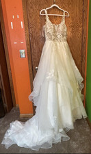 Ivory Lace Beaded Sleeveless Ball Gown Wedding Dress with Train and Button Back