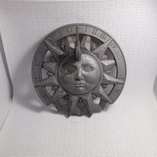 Vintage Cast Metal SundialΒ featuring A Sun Face Design And Roman Numerals