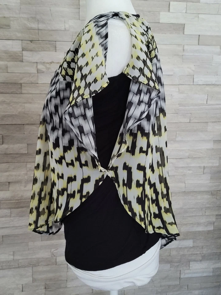 Blusa estilo poncho AB Studio para mujer grande negra amarilla adjunta sin mangas elástica Foto 2 de 4