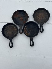 4 miniature advertising cast iron skillets