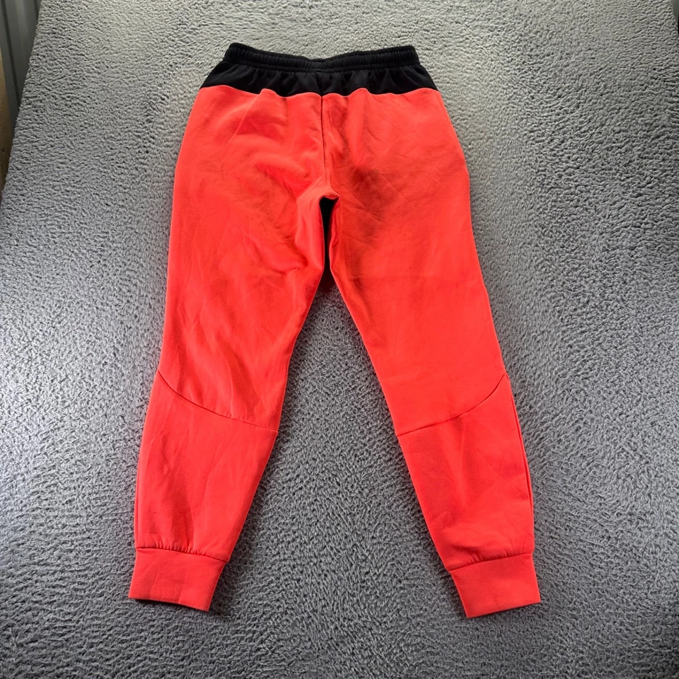 Pantalones deportivos Under Armour para hombre medianos naranja poliéster elástico ajuste cónico Foto 4 de 4