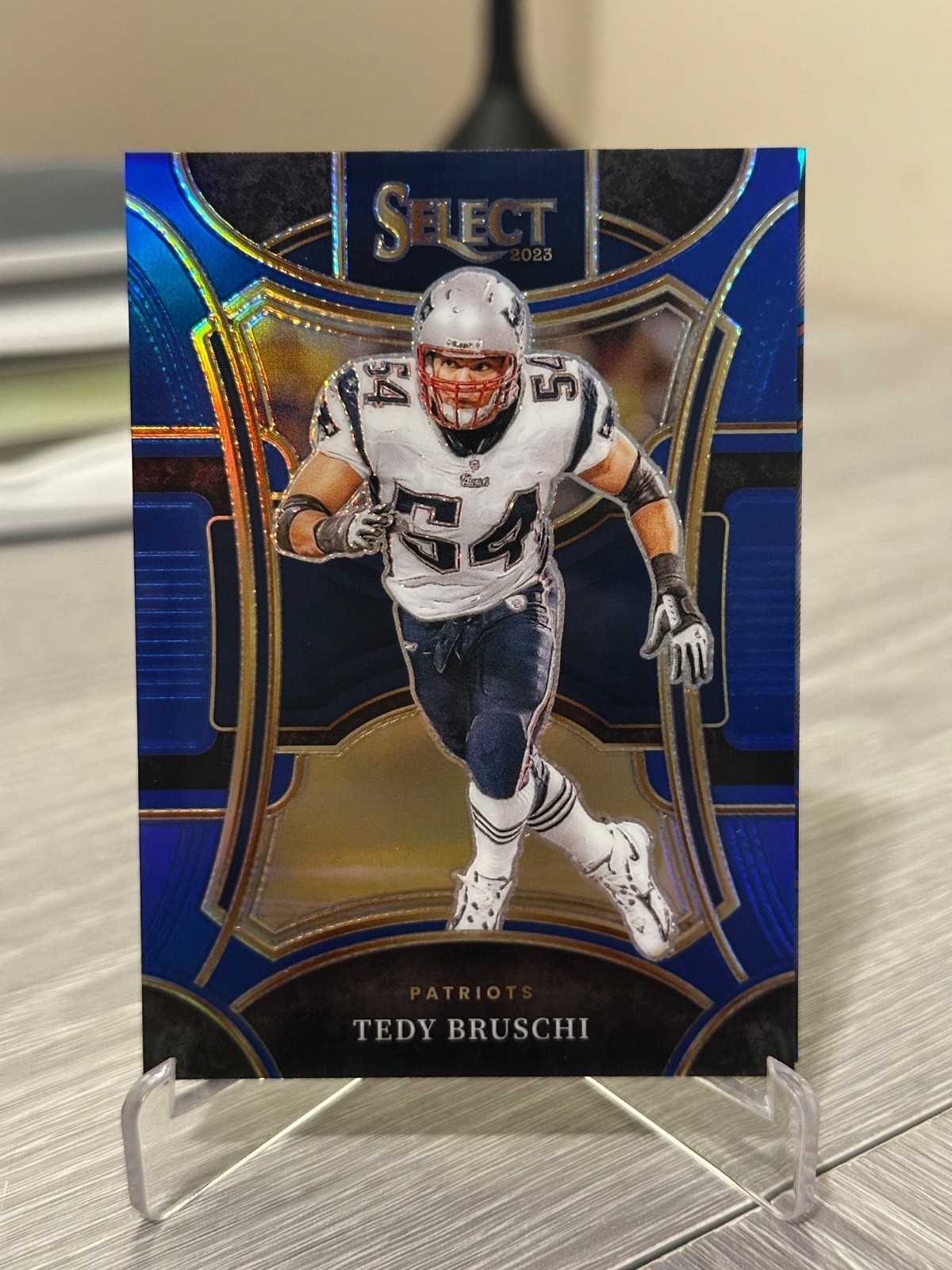 2023 Panini Select Suite Level Blue Prizm /99 - Tedy Bruschi #465
