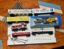 Collectible Toy Trains with tracks, poles, and signs. Good condition.
