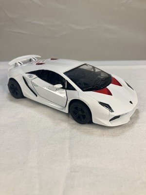 Kinsmart 1:38 scale die-cast model of a white Lamborghini Sesto Elemento.