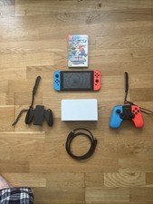 Nintendo Switch With Accessories And Controllers.