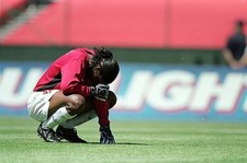 Goalkeeper Briana Scurry USA kneels on the field at the women's Wo- Old Photo
