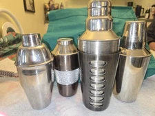 Lot Of 4 Stainless Steel Cocktail Shakers. One Has Recipes And A Guide Sleeve.