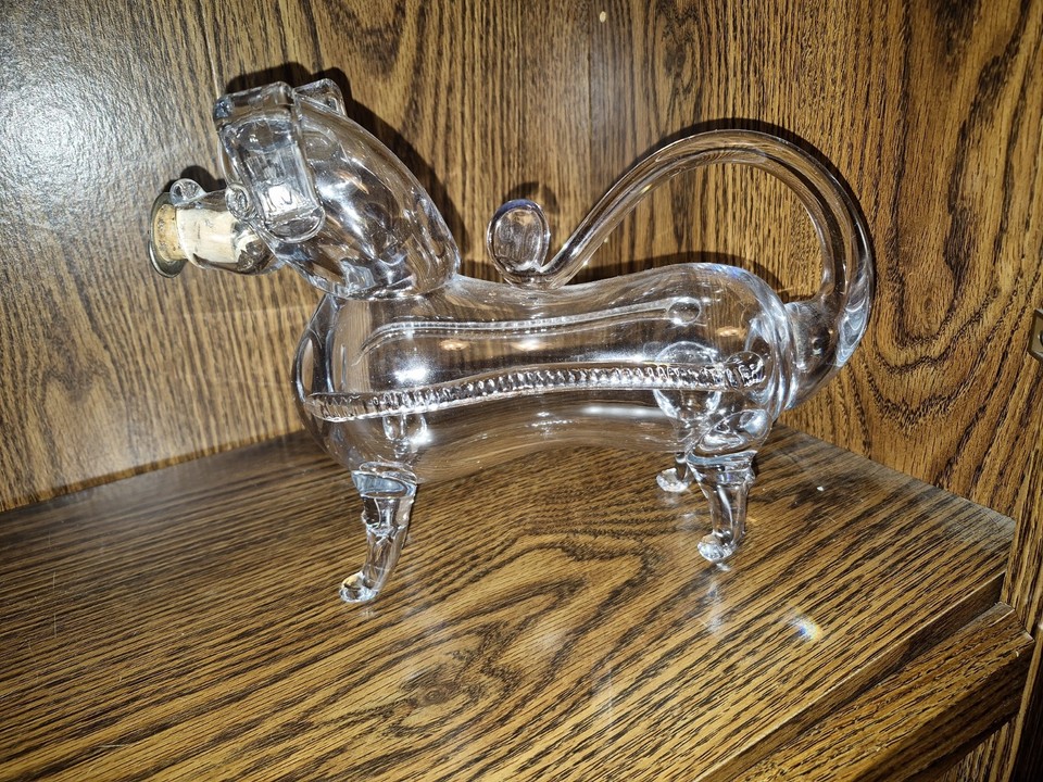 A 1920s glass decanter shaped like a Dachshund — utterly one-of-a-kind novelty antique that exists at the perfect intersection of art and absurdity.
