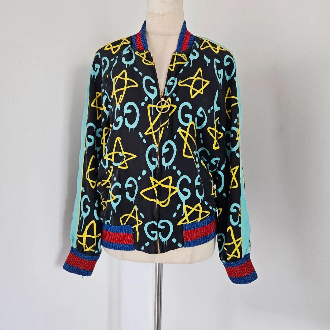 Cardigan Gucci blu navy GG giallo vernice spray stella zip