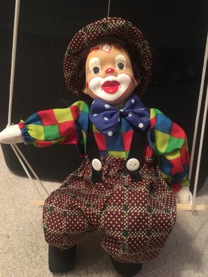 porcelain clown on swing