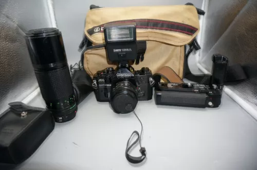 Canon A-1 35mm SLR Camera W/ 100-200mm , 50mm lens, Motor Drive, 166A Flash, Bag