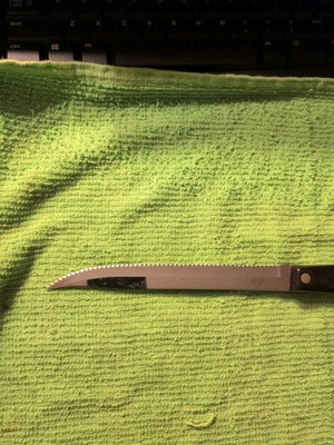 CUTCO CUTTING KNIFE WITH APPROX 13'' BLACK HANDLE