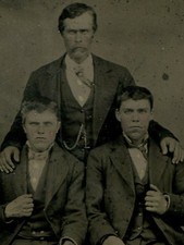 UNHAPPY FATHER WITH UNHAPPY SONS. MEAN LOOKING. TINTED TINTYPE, PERIOD MAT. 