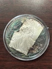 2003 AMERICAN SILVER EAGLE BU 1 OZ SILVER WITH ONING