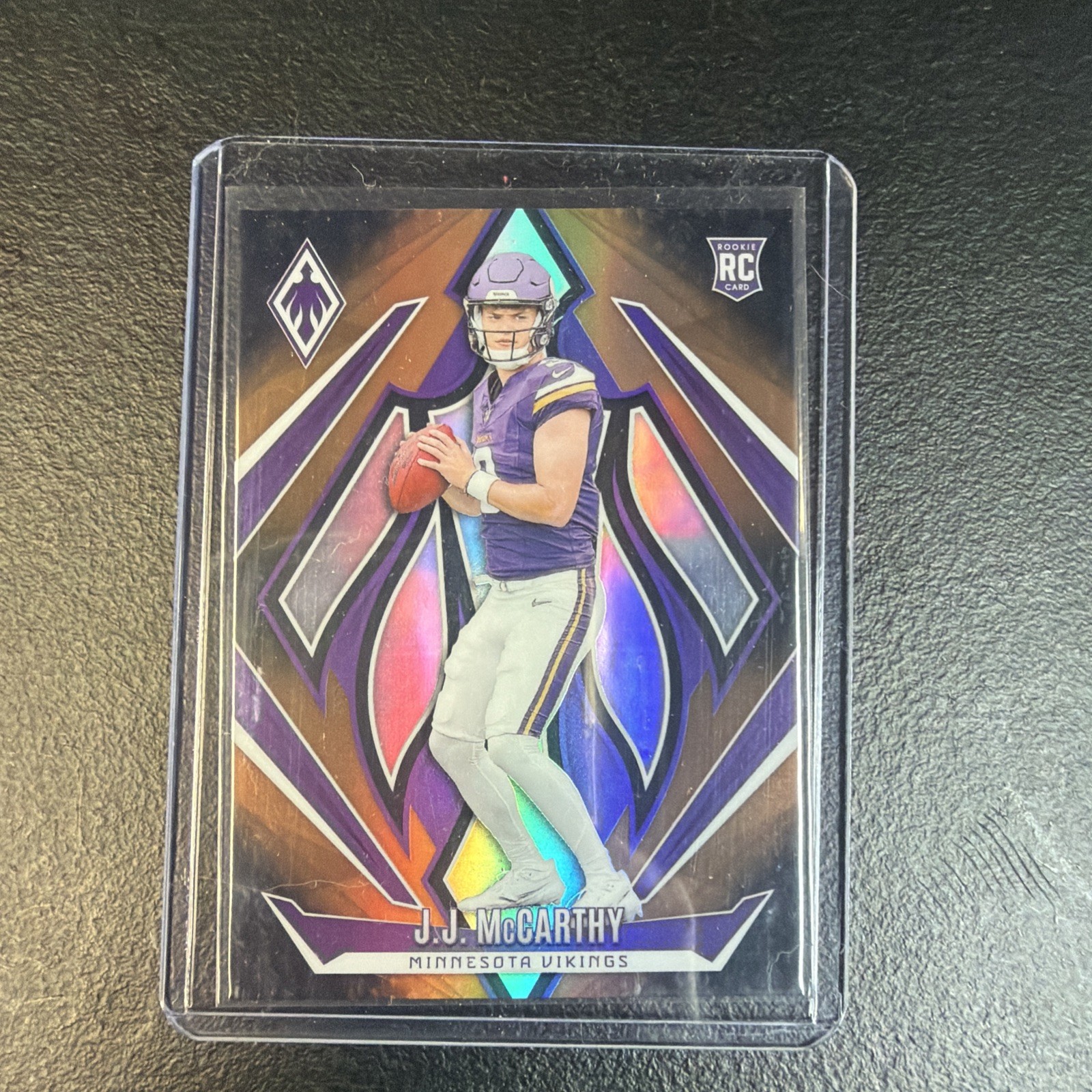 2024 Panini Phoenix - Rookies J.J. McCarthy #185 Bronze Fade /125 (RC)