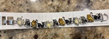 Pammy J Cat Bracelet with Cute Black, White, And Gold Tone Kitties.