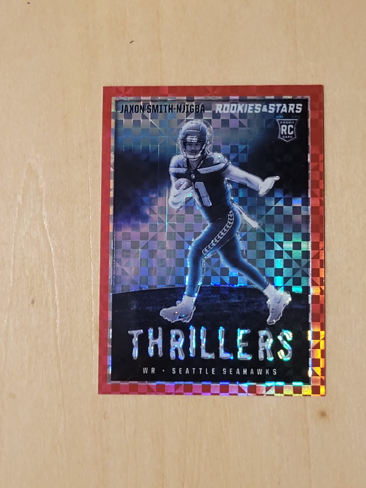 Jaxon Smith-Njigba 2023 Panini Rookies And Stars Thrillers Red Plaid Prizm. SEA 