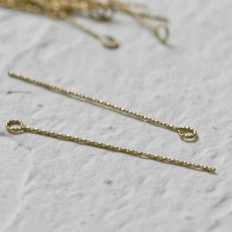 Pin de ojo texturizado de latón crudo 50 piezas - Base de latón - 40x0,7 mm (CW-4151C) Foto 2 de 3