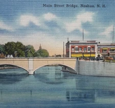 Main Street Bridge - Nashua, New Hampshire. Concrete Bridge Over River. Downtown