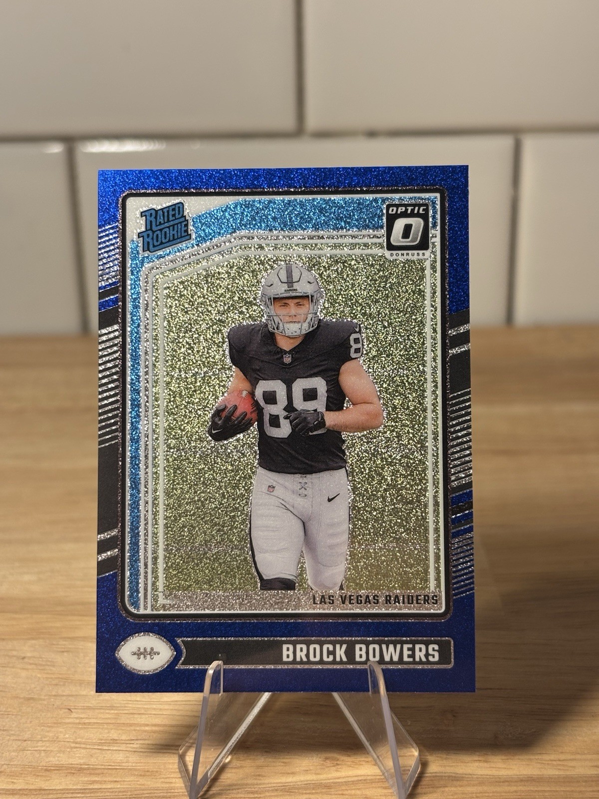 2024 Panini Donruss Optic -Rated Rookie Brock Bowers #215 SSP Blue Glitter Prizm