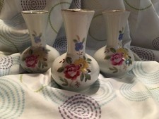 Three small ceramic flower vases with gold trim & floral decoration on the sides
