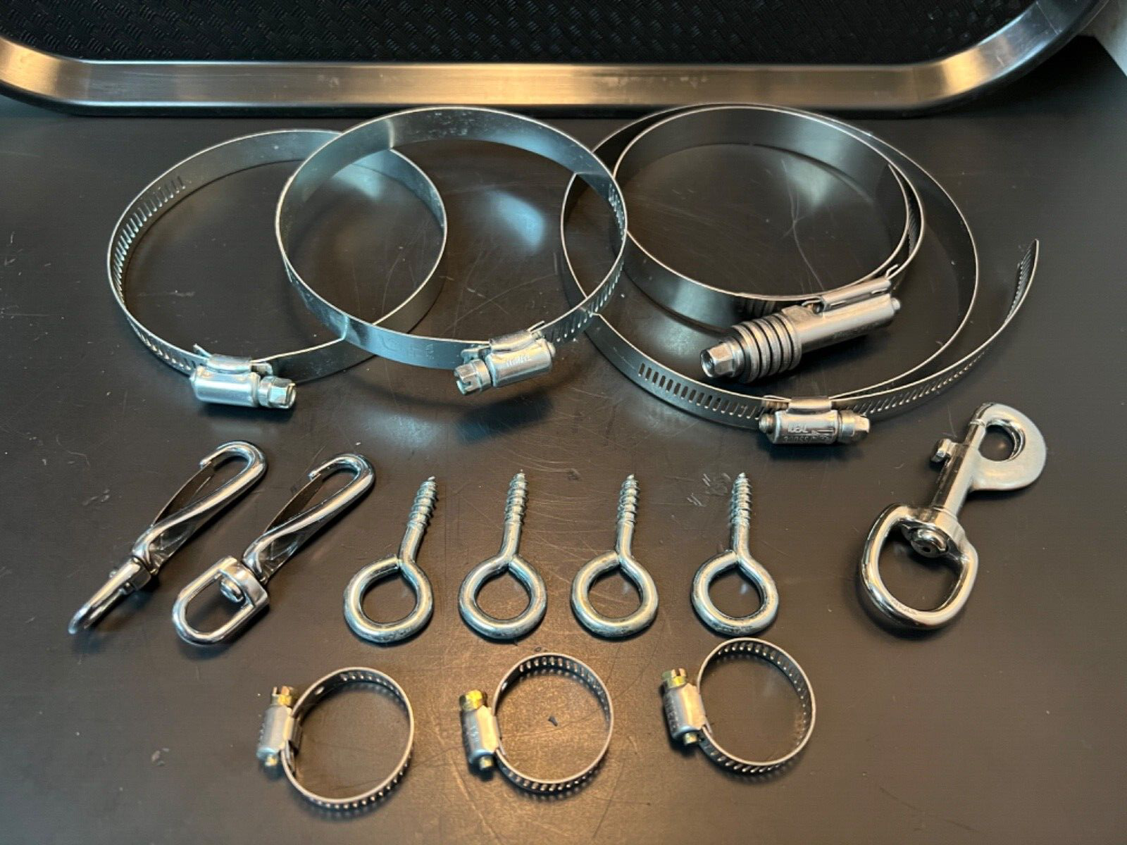 Assorted hose clamps and fasteners. new