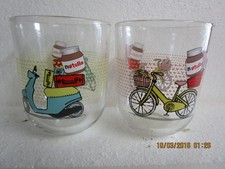Nutella glasses. blue scooter and yellow bike carrying Nutella. excellent.