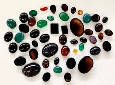 lot of 100 Carats of assorted loose gemstones varied size and shape Cabochon
