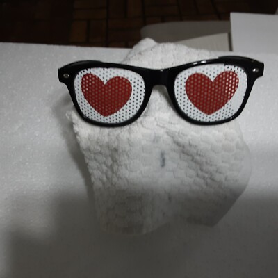 SUNGLASSES ASCENSION SUNGLASSES WITH RED HEART LENS WHITE BACKGROUND
