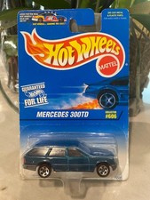 1996 Hot Wheels Blue/White Card #606 MERCEDES 300TD Green w/Chrome 5 Spokes