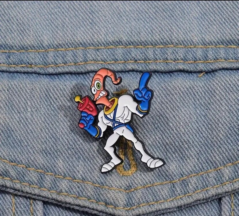 jeu earthworm jim pin's celebre megadrive épingle fixation