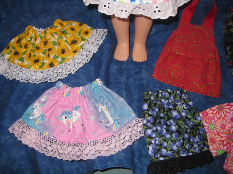 11 Piece Assortment For 14.5" Wellie Wisher Doll, 6 Skirts, Shirt, Shorts, Purse