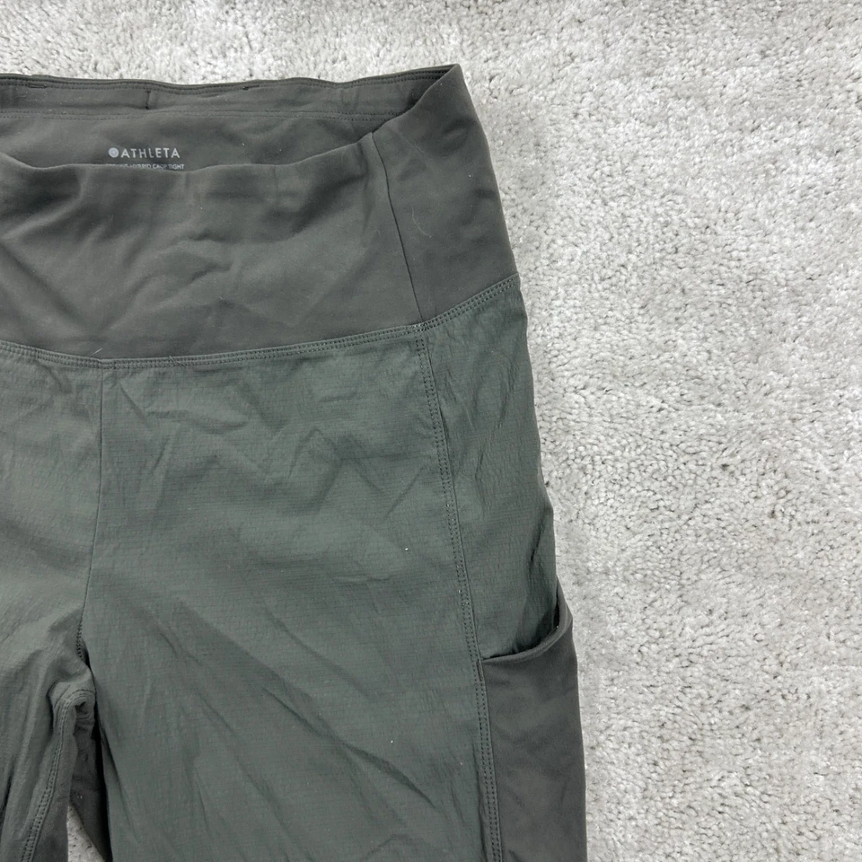 Leggings Athleta Trekkie Crop híbrida feminina tamanho 10 alta verde bolsos puxados - Imagem 3 de 4