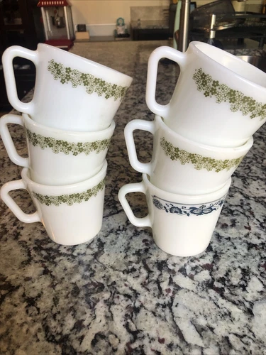 6 Pyrex, 5 Spring Blossom Crazy Daisy Coffee Cups 1 Old town blue cup